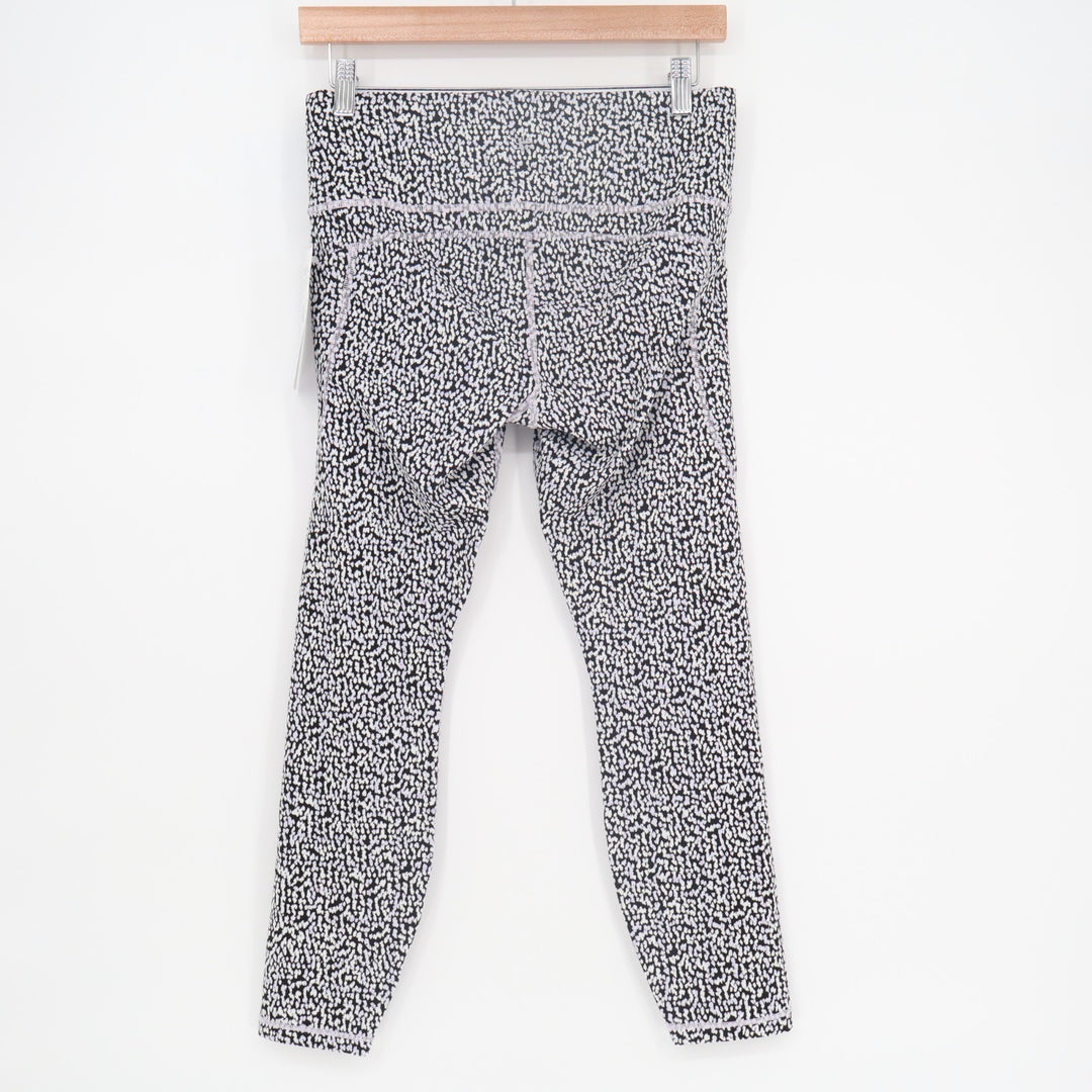 Athleta Ultimate Stash Textured 7/8 Leggings Womens M White Black Leopard Print