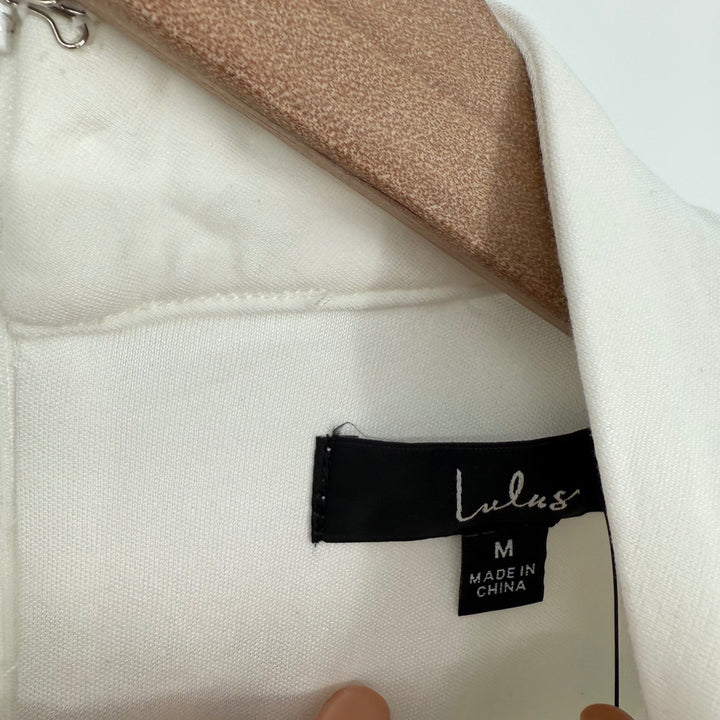 Close-up of a Lulus label on a garment with beige lining.