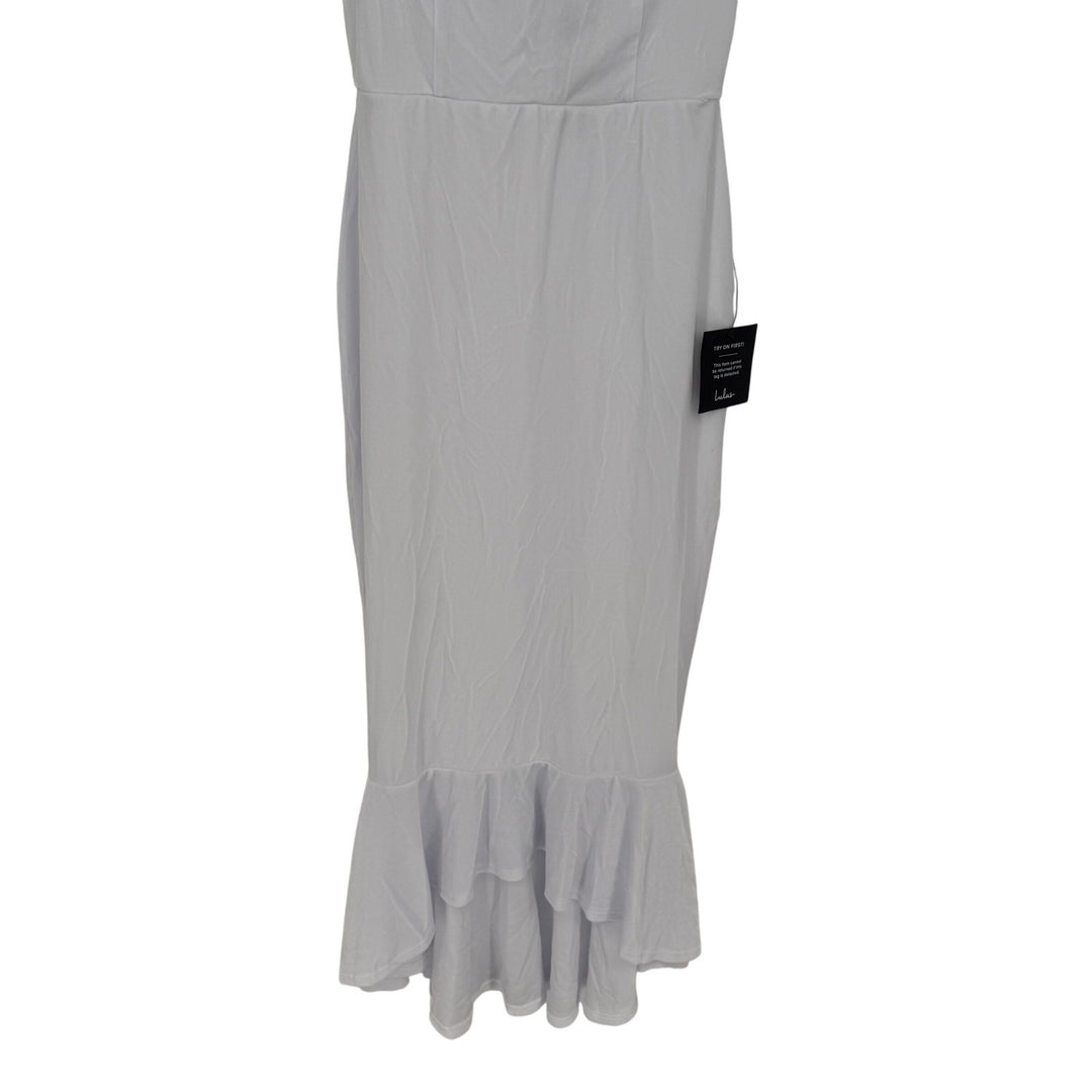 Light gray dress with ruffled hem on a white background