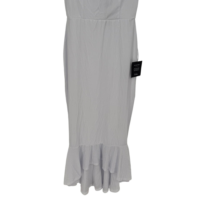 Light gray dress with ruffled hem on a white background