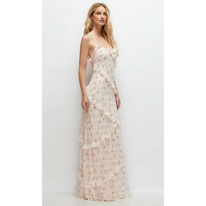 Woman wearing a floral dress against a white background