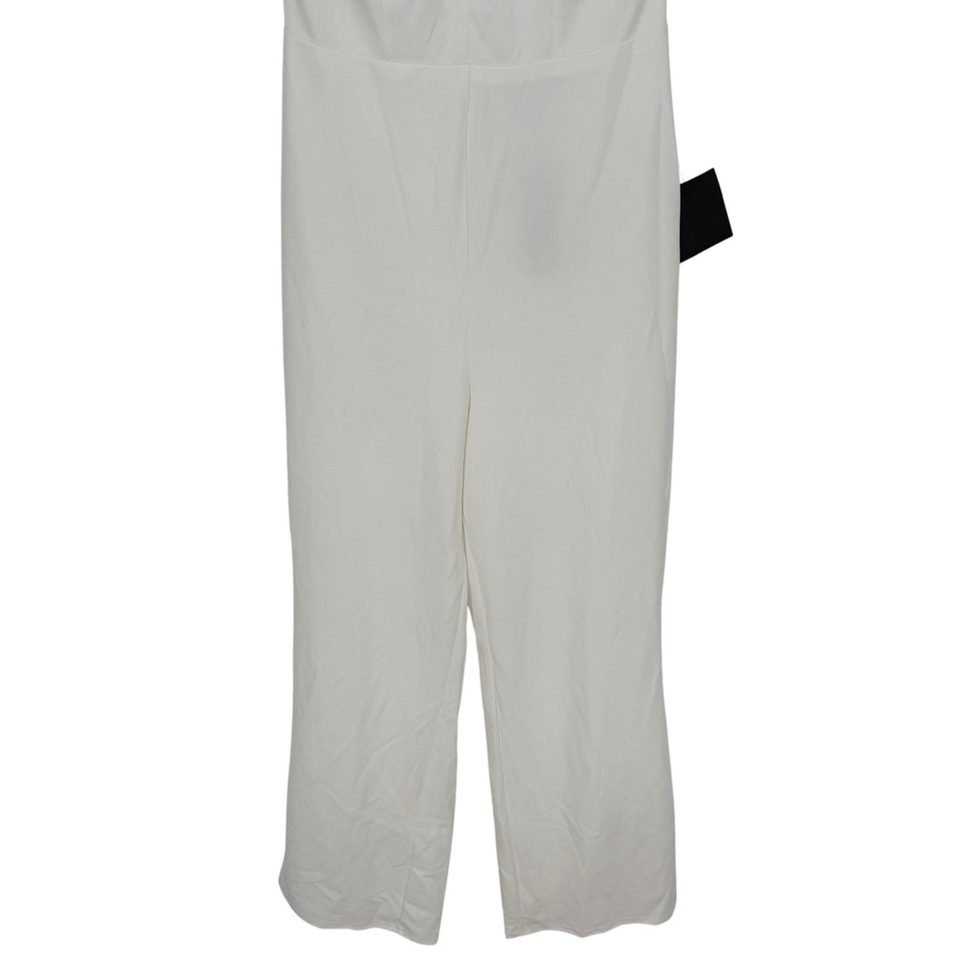 White pants with a black tag on a white background