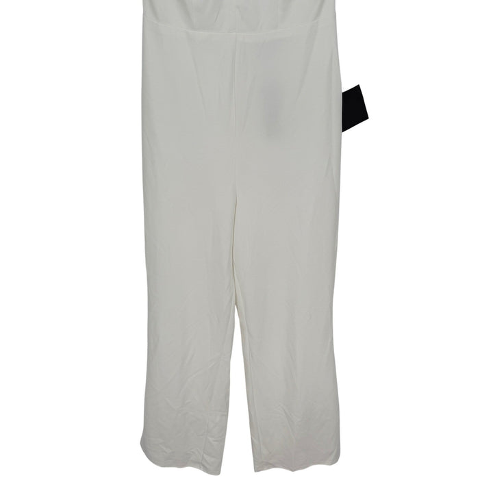 White pants with a black tag on a white background