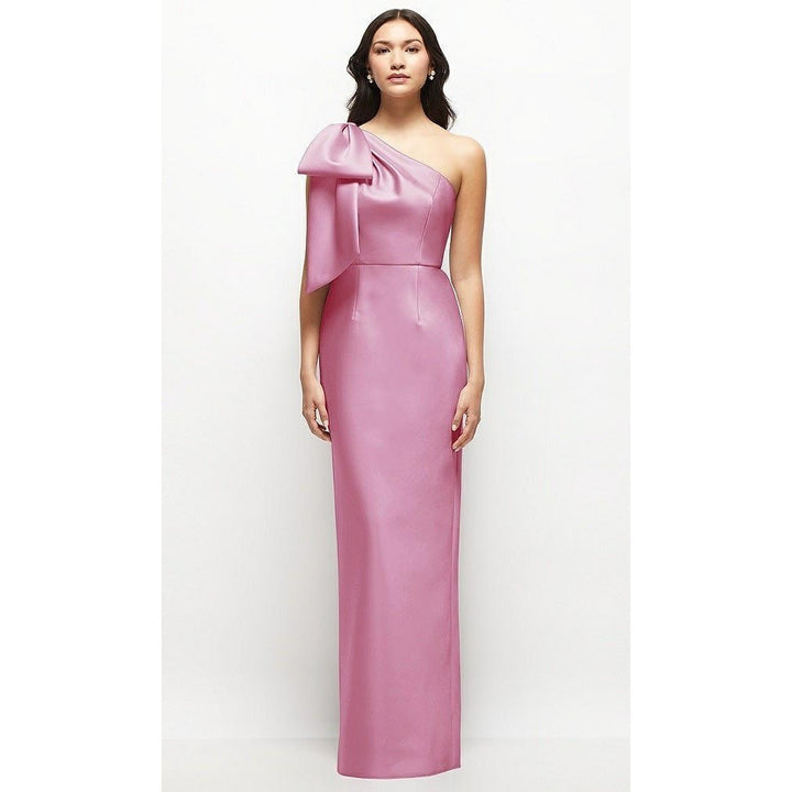 Woman wearing a pink one-shoulder gown on a white background