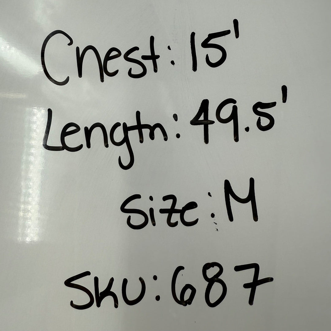 Measurement labels on a white surface with text indicating 'Chest: 15', 'Length: 49.5', 'Size: M', and 'SKU: 687'.