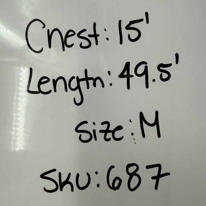 Measurement labels on a white surface with text indicating 'Chest: 15', 'Length: 49.5', 'Size: M', and 'SKU: 687'.