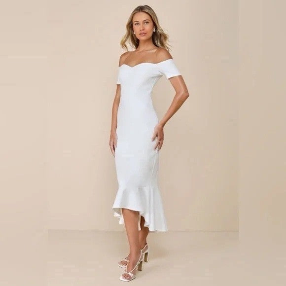 Woman wearing a white off-shoulder dress against a beige background