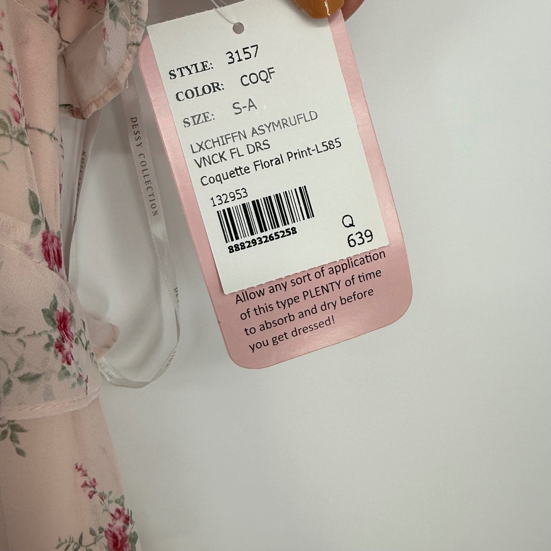 Floral dress with a tag displaying style, color, size, and care instructions.