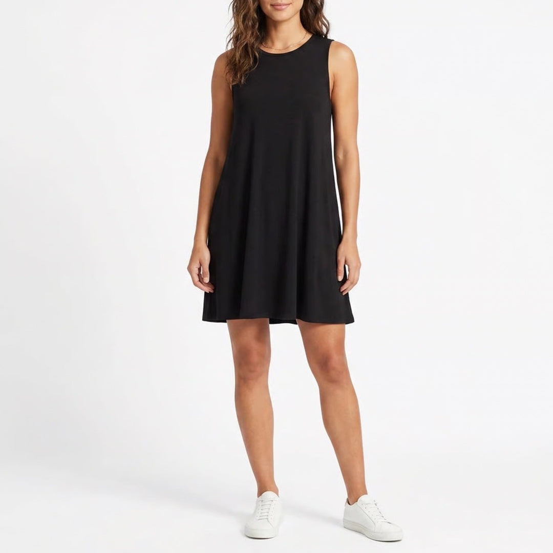 Woman wearing a black sleeveless dress on a white background