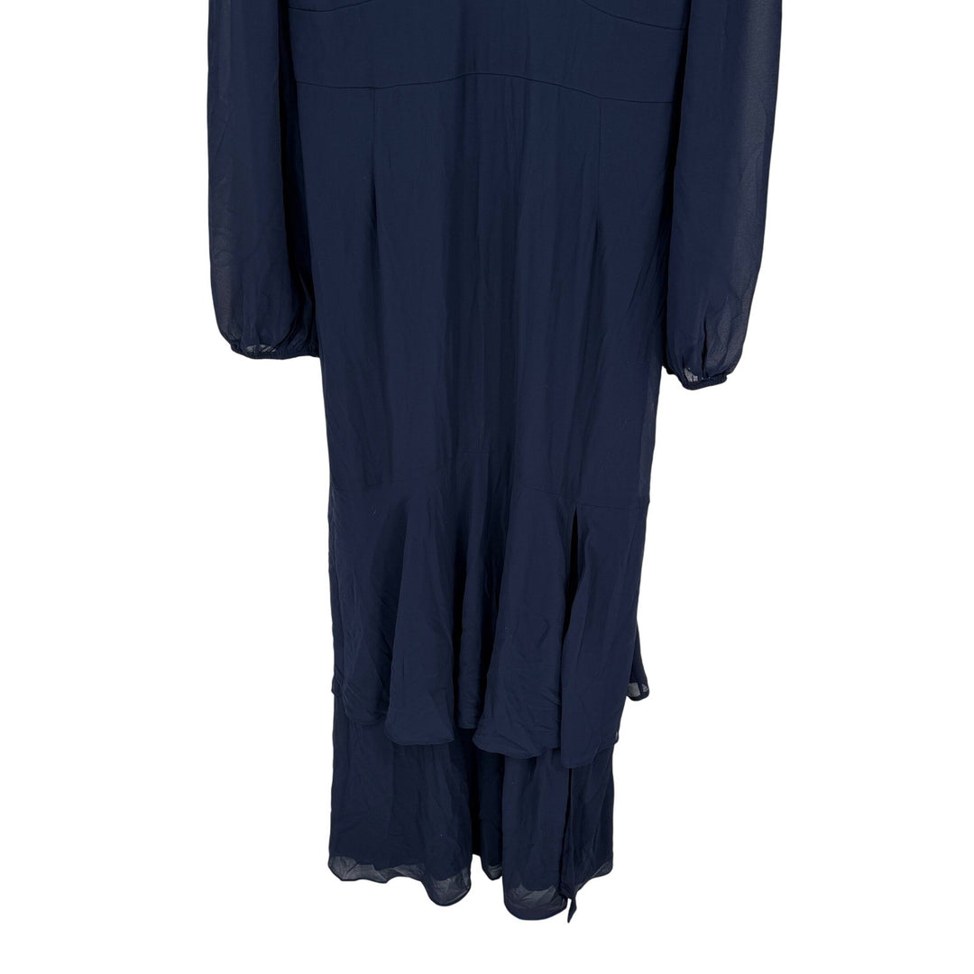 Navy blue dress with layered skirt on a white background