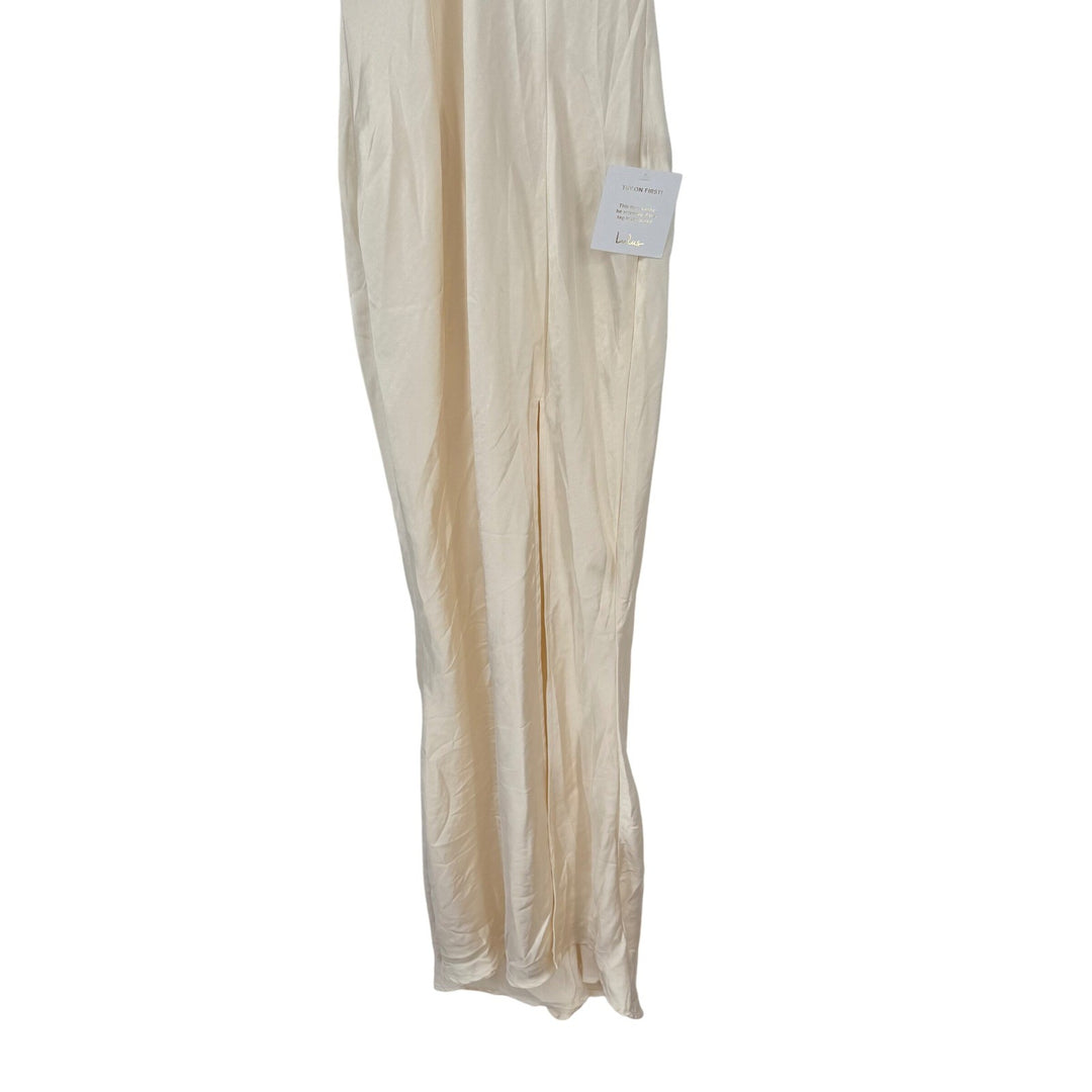 Beige skirt on a white background with a tag attached.
