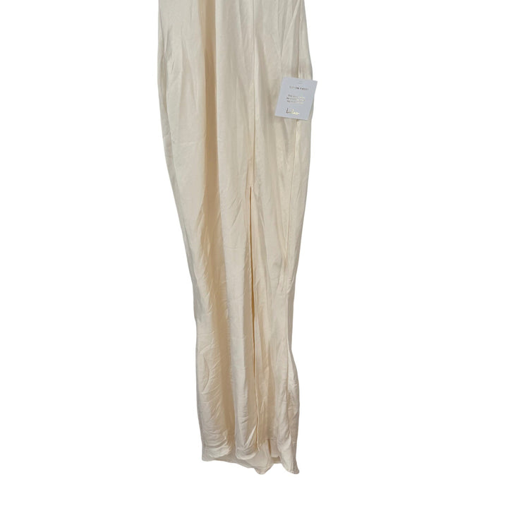 Beige skirt on a white background with a tag attached.