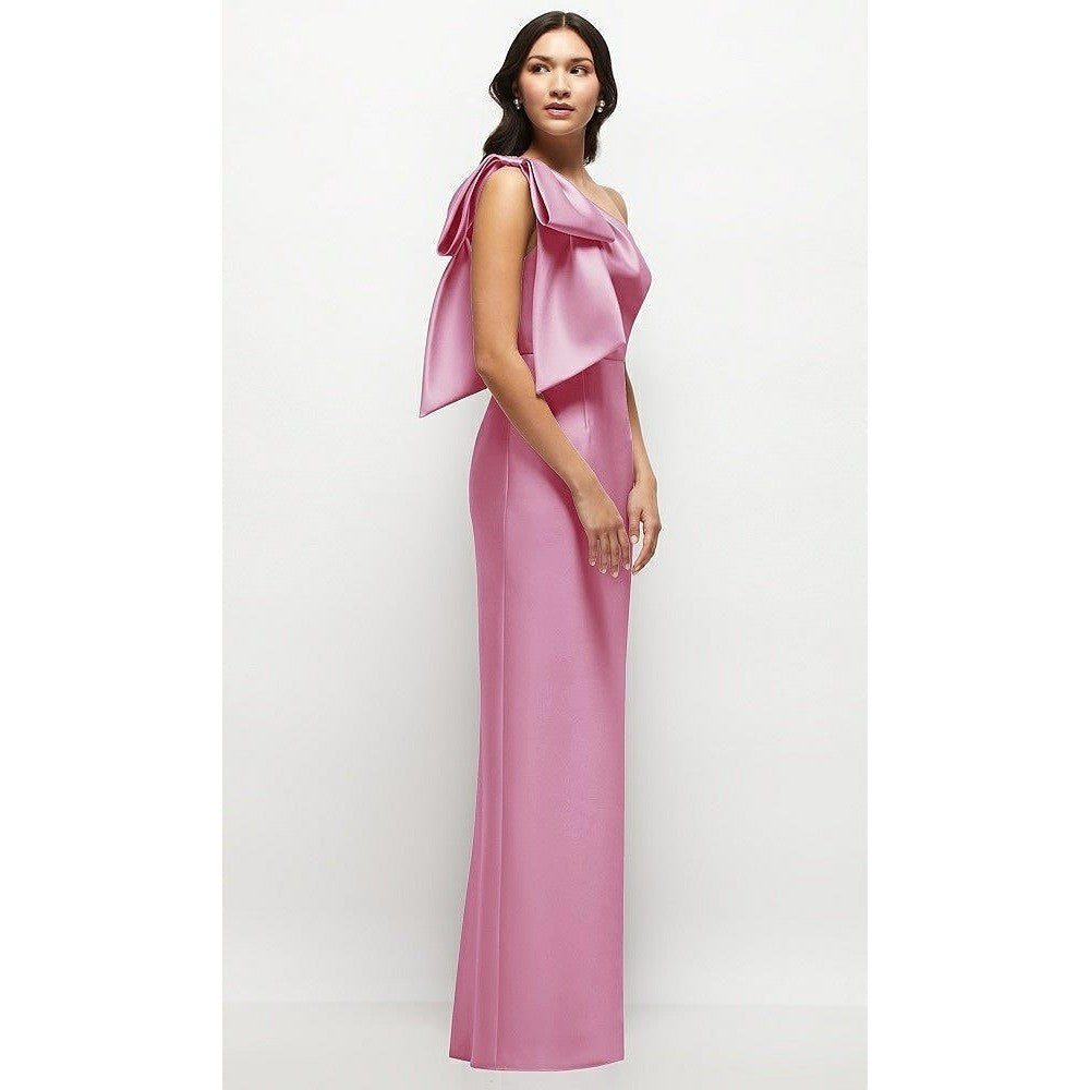 Woman wearing a pink one-shoulder dress on a white background