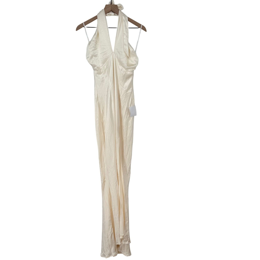 White halter neck dress on a hanger against a white background