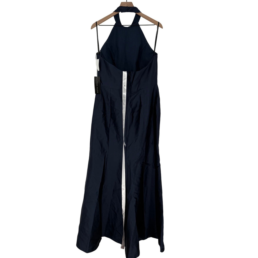 Black dress on a hanger against a white background