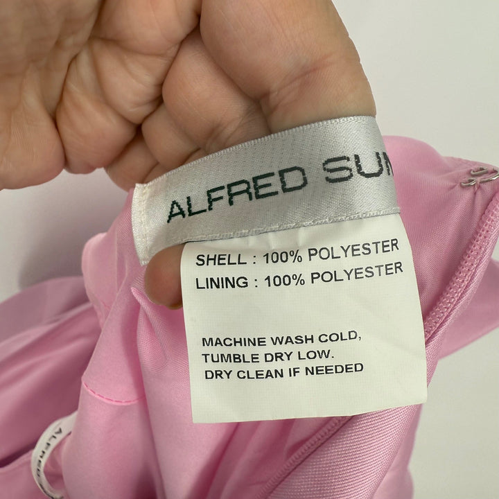 Close-up of a clothing label on a pink garment with 'Alfred Sung' branding.
