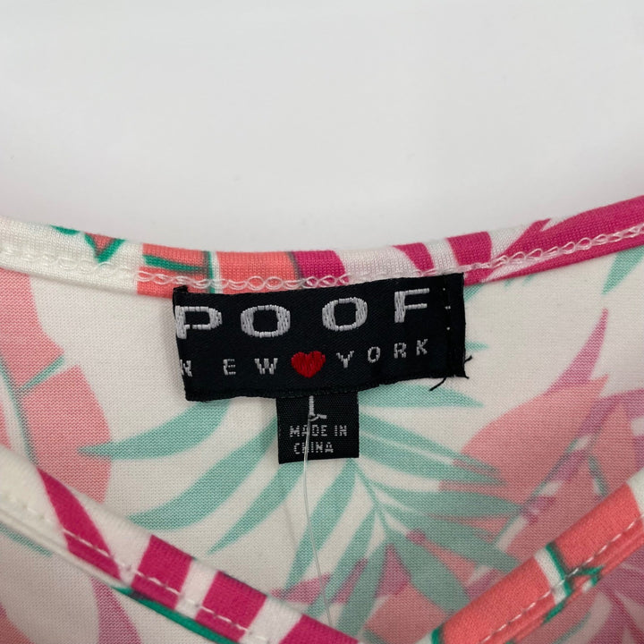 Label on a shirt with a colorful pattern, featuring the brand 'POOF'.