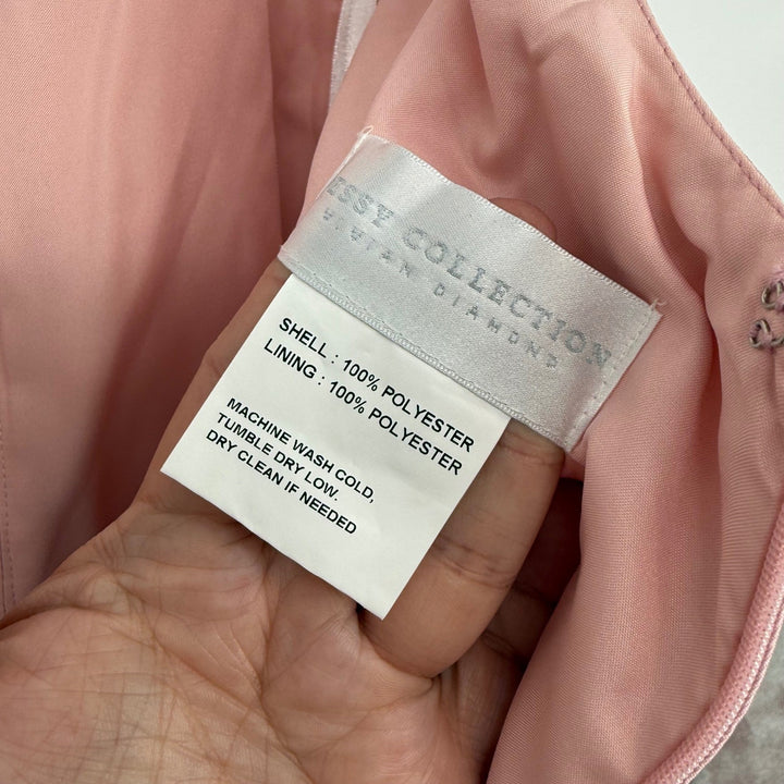 Clothing label on a pink garment with 'Dessy Collection' branding.