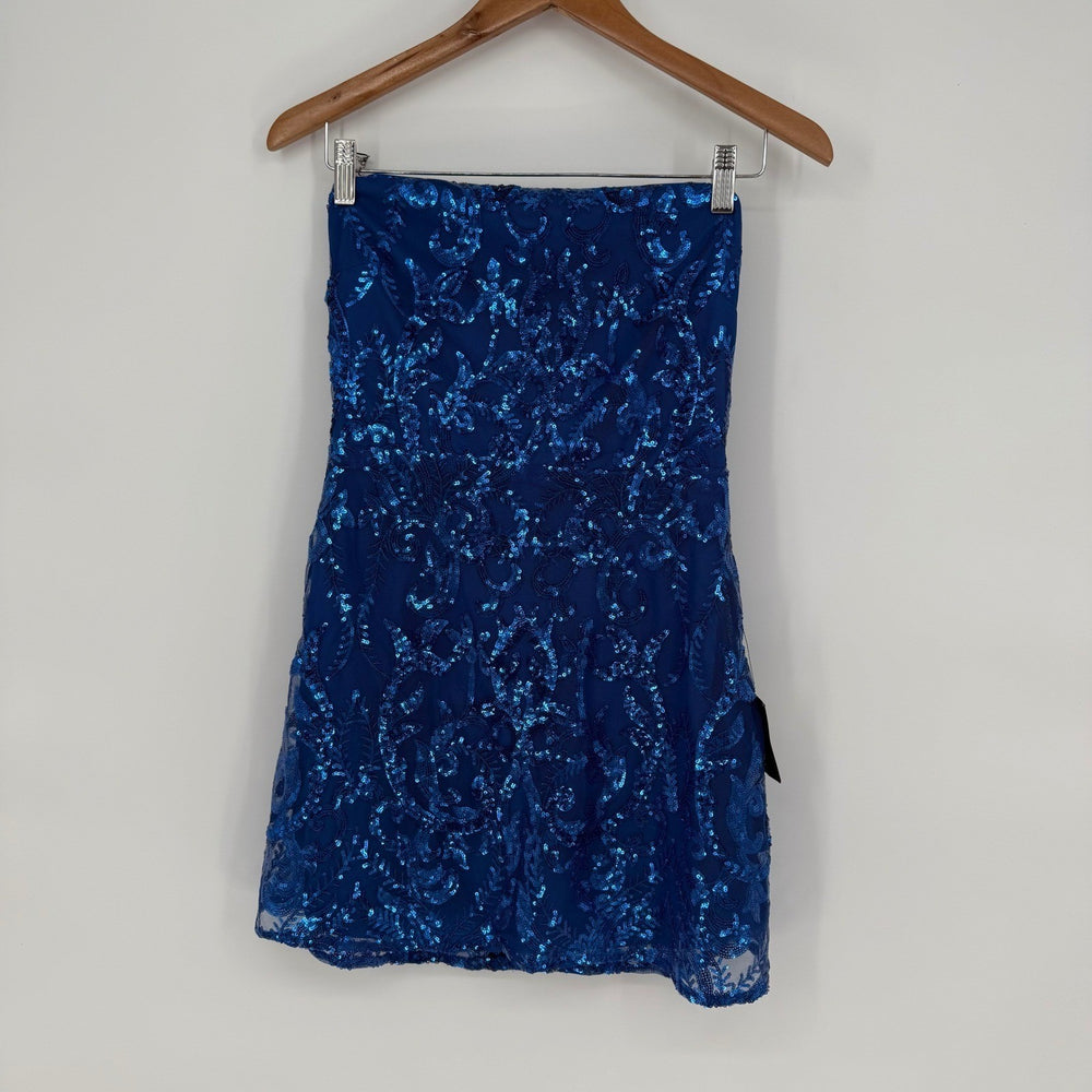 Blue sequin skirt on a hanger against a white background