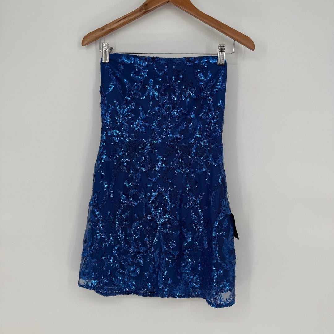 Blue sequin skirt on a hanger against a white background