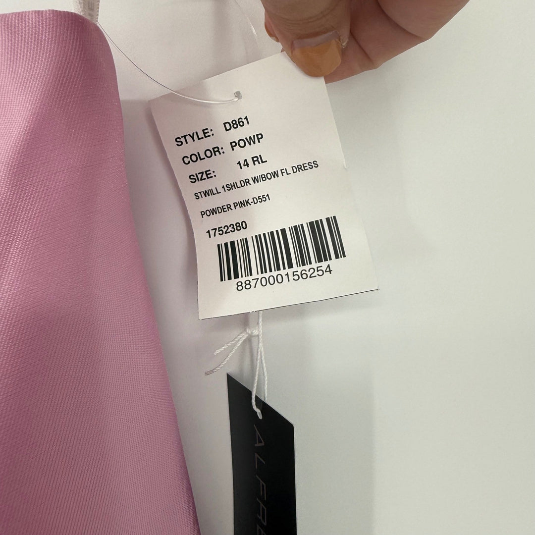 Clothing tag with product details on a garment, held by a hand.