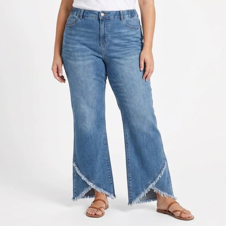 Blue denim wide-leg jeans worn by a person on a white background