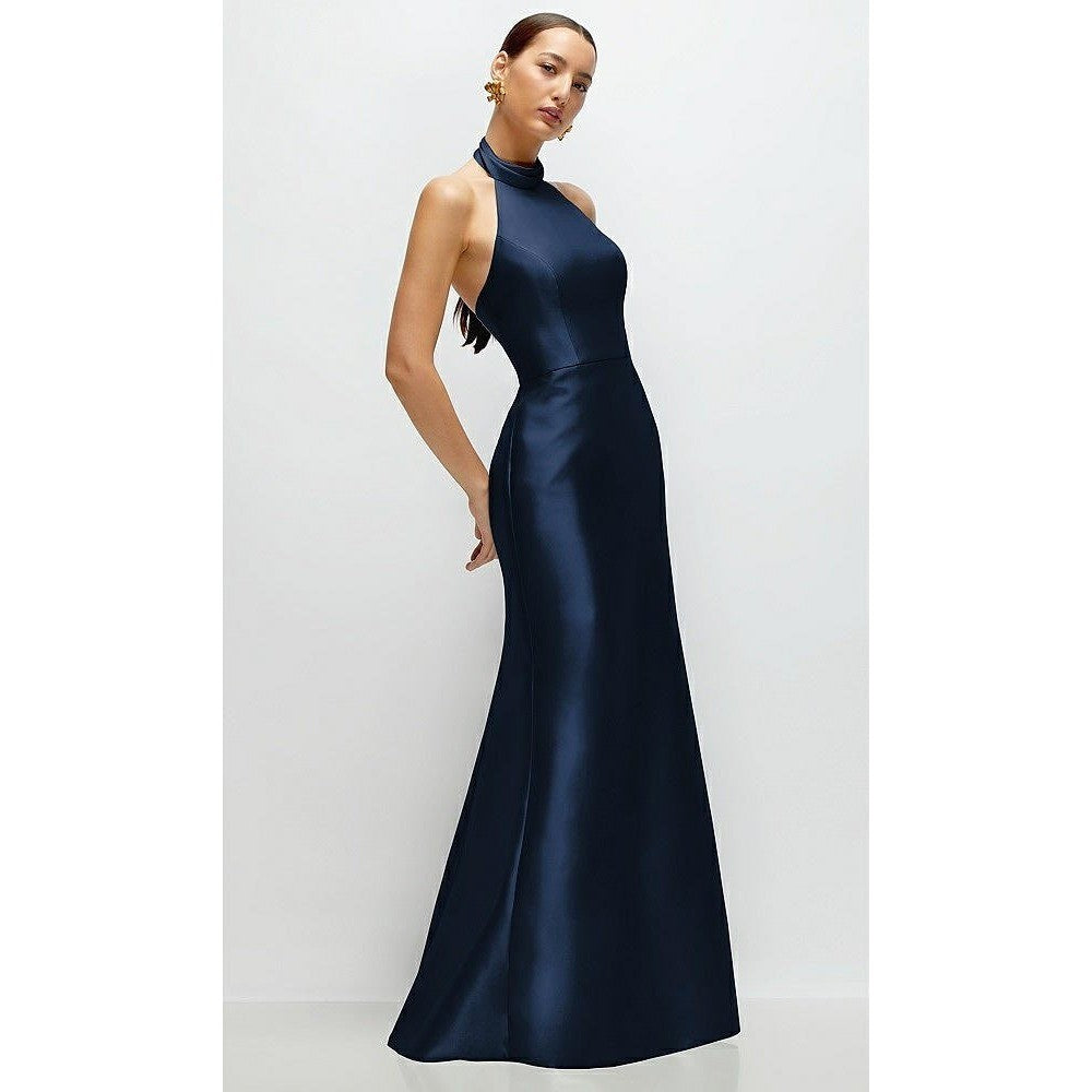 Woman wearing a navy blue evening gown on a white background
