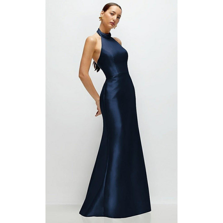 Woman wearing a navy blue evening gown on a white background