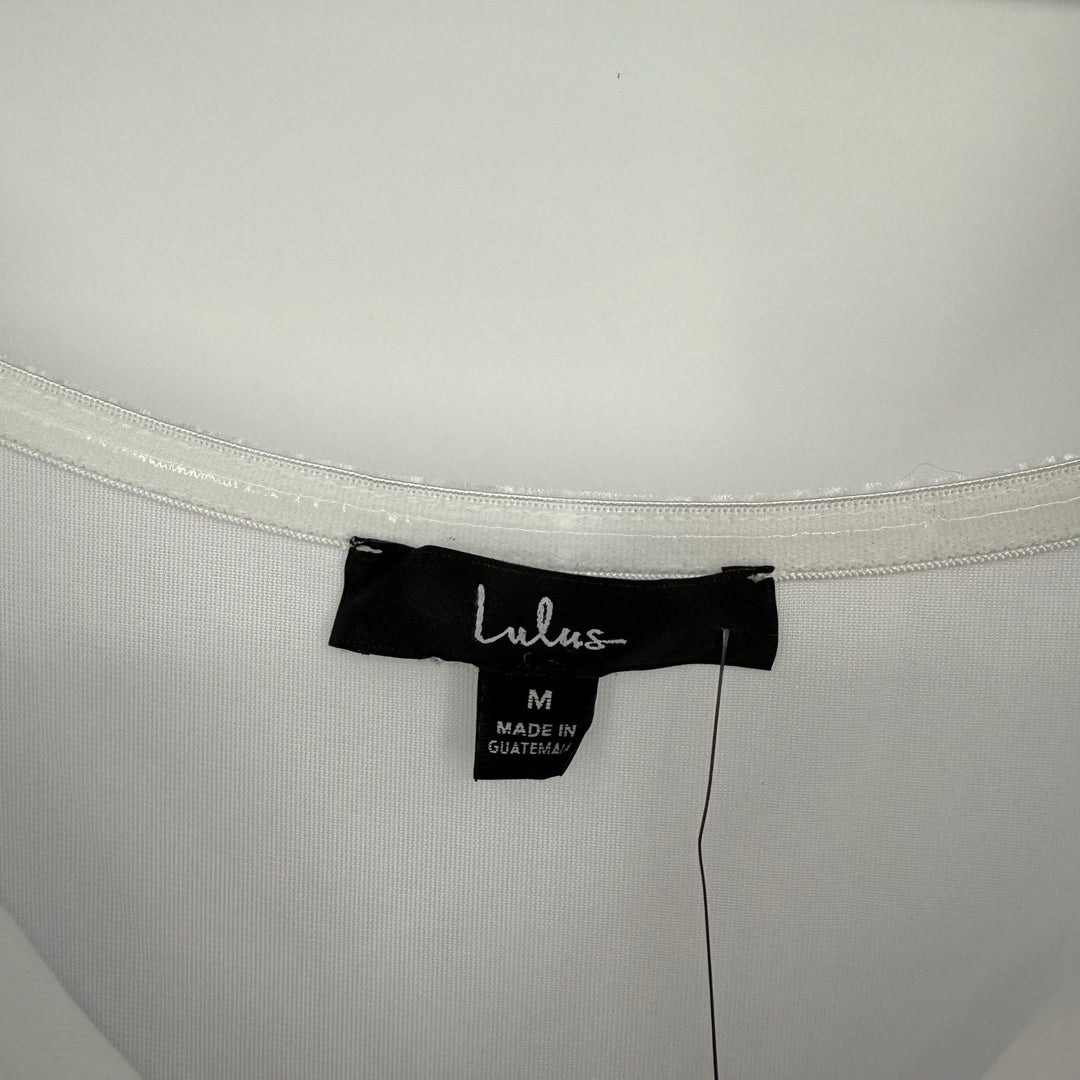 Lulus brand tag on a white garment with a visible label.