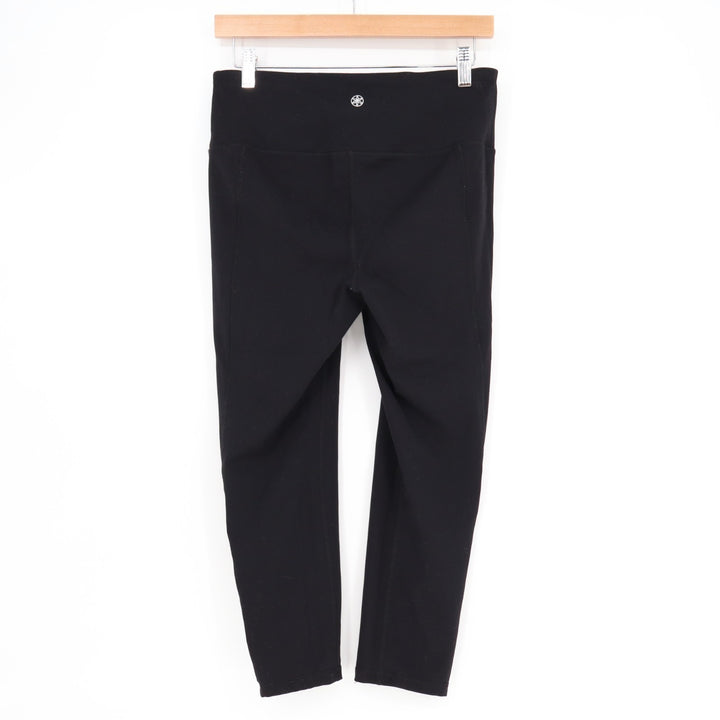 Gaiam Om Lotus Capri Leggings Womens Medium Black Stratch Cutout Hem High-Waist