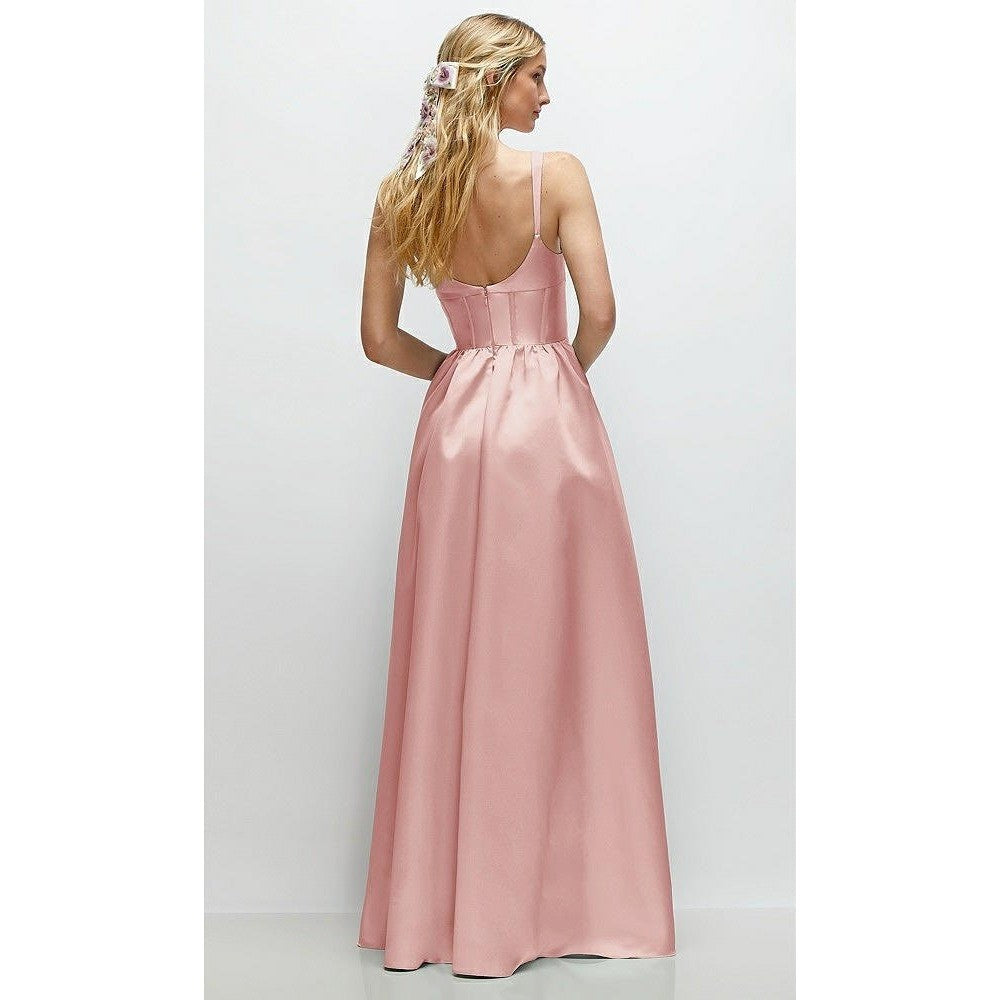 Woman wearing a pink evening gown with a white background