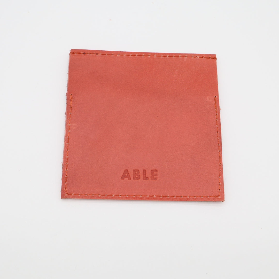 ABLE Womens Minimalist Card Holder Orange Leather Embossed Logo Fold Over Flap