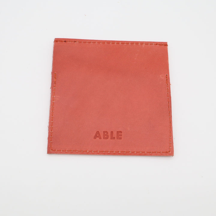 ABLE Womens Minimalist Card Holder Orange Leather Embossed Logo Fold Over Flap