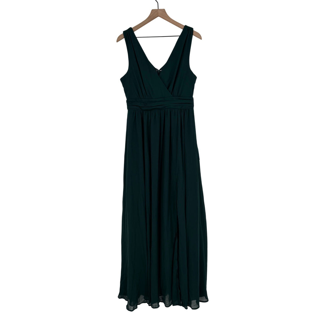 Dark green dress on a hanger against a white background