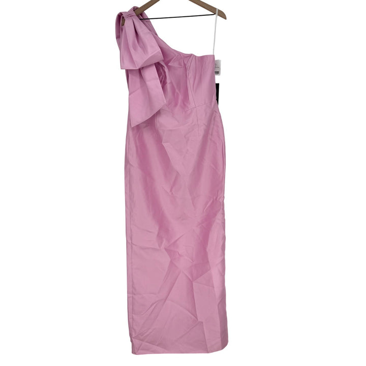 Pink one-shoulder dress on a hanger against a white background