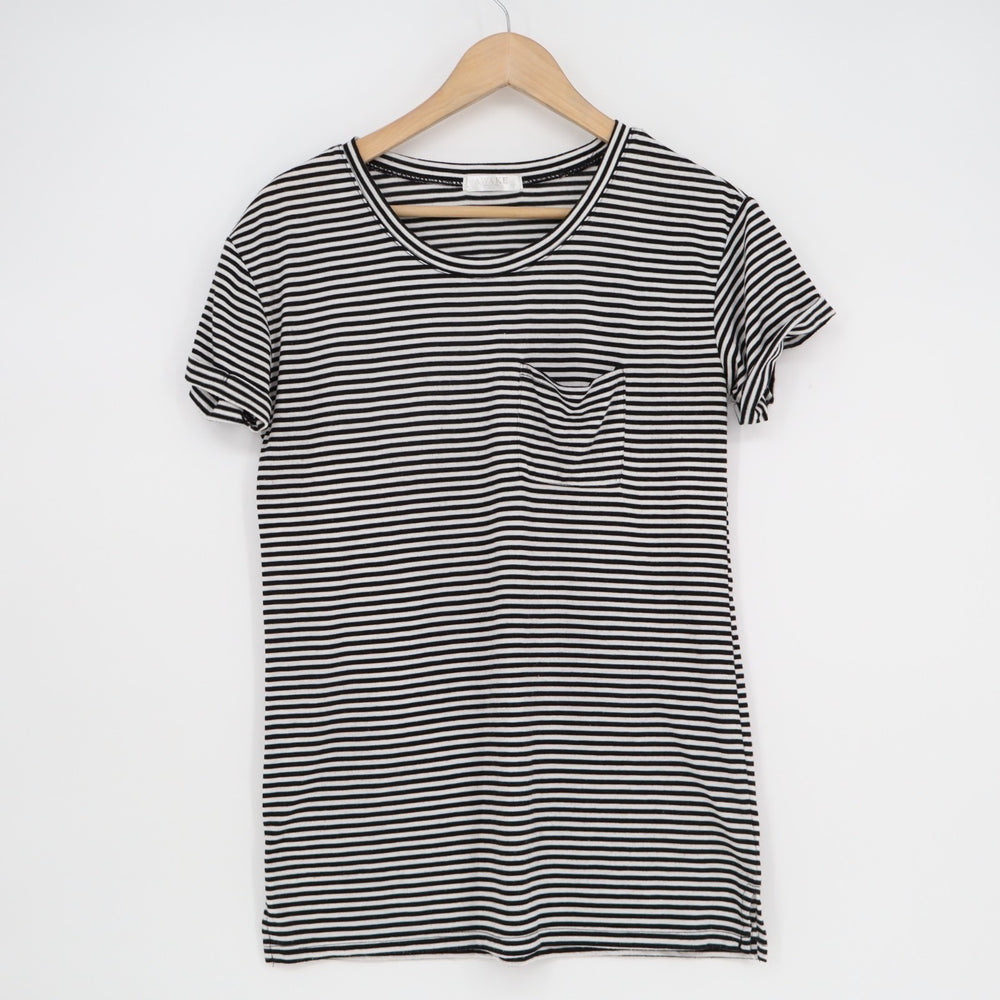 Black and white striped dress on a hanger against a white background